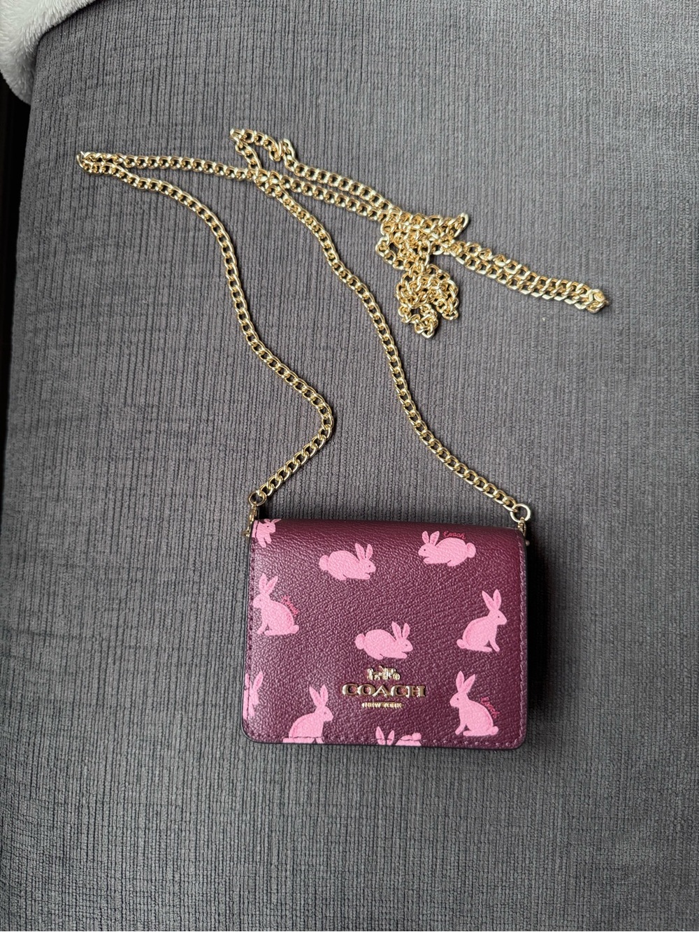Coach Maroon Crossbody Wallet with Pink Bunny Print and Gold Chain
